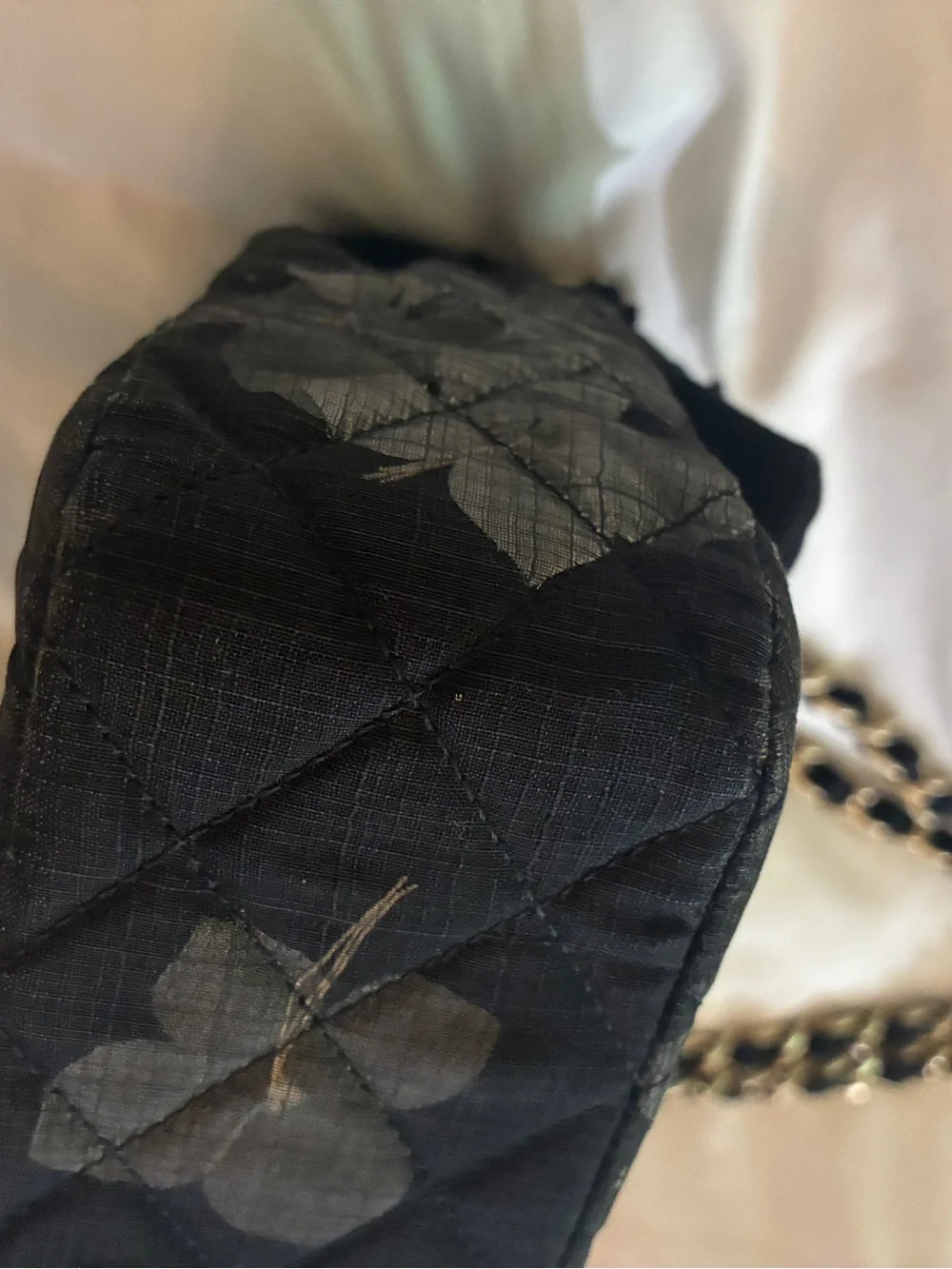 CHANEL Black Quilted Shoulder Bag with Red Floral Appliqués